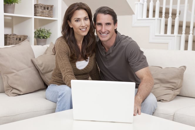 Couple in home w computer stock.jpg